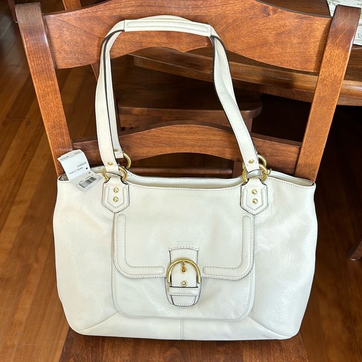 Ivory Coach Bag With Gold Accents White Everyday Bag With Handle Drop, White Hobo Bag With Double Handle, Classic White Shoulder Bag With Gold-tone Hardware, White Tote Bag With Handle Drop, Elegant White Hobo Bag With Double Handle, White Satchel With Double Handle And Handle Drop, White Double Handle Satchel With Handle Drop, Everyday White Satchel With Handle Drop, Classic White Rectangular Hobo Bag