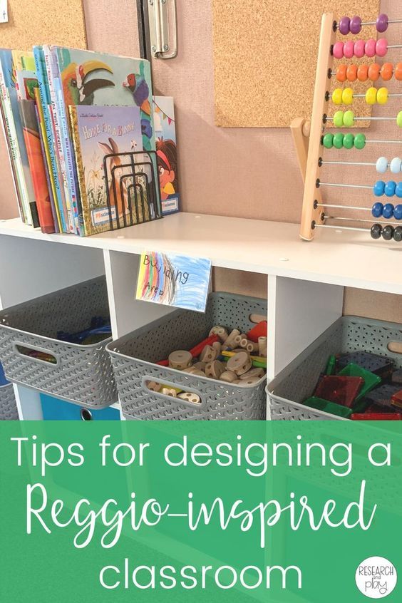 an organized classroom area with toys and books