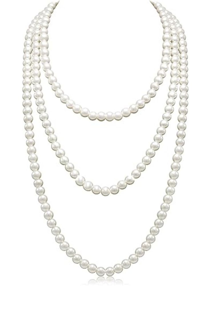 three strand pearl necklace on a white background