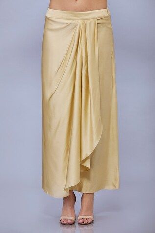 Beige draped skirt in blended satin base. - Aza Fashions Draped Lined Skirt, Elegant Draped Gathered Skirt Bottoms, Relaxed Draped Skirt For Evening, Formal Draped Flowy Skirt, Elegant Draped Gathered Skirt, Lined Draped Skirt For Evening, Relaxed Ruched Draped Skirt, Elegant Draped Flowy Skirt With Folds, Flowy Long Draped Skirt With Folds