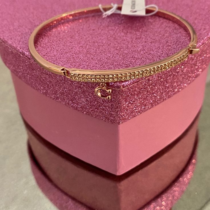 Brand Rose Gold Pink Bangle With C On It. It’s Super Cute . Luxury Adjustable Bracelet By Coach, Luxury Adjustable Coach Bracelets, Luxury Adjustable Coach Bracelet, Elegant Adjustable Coach Bracelets, Coach Adjustable Bracelet As Gift, Adjustable Coach Bracelets As Gift, Adjustable Coach Bracelets For Gift, Coach Bangle Bracelets Gift, Chic Coach Bangle Bracelet