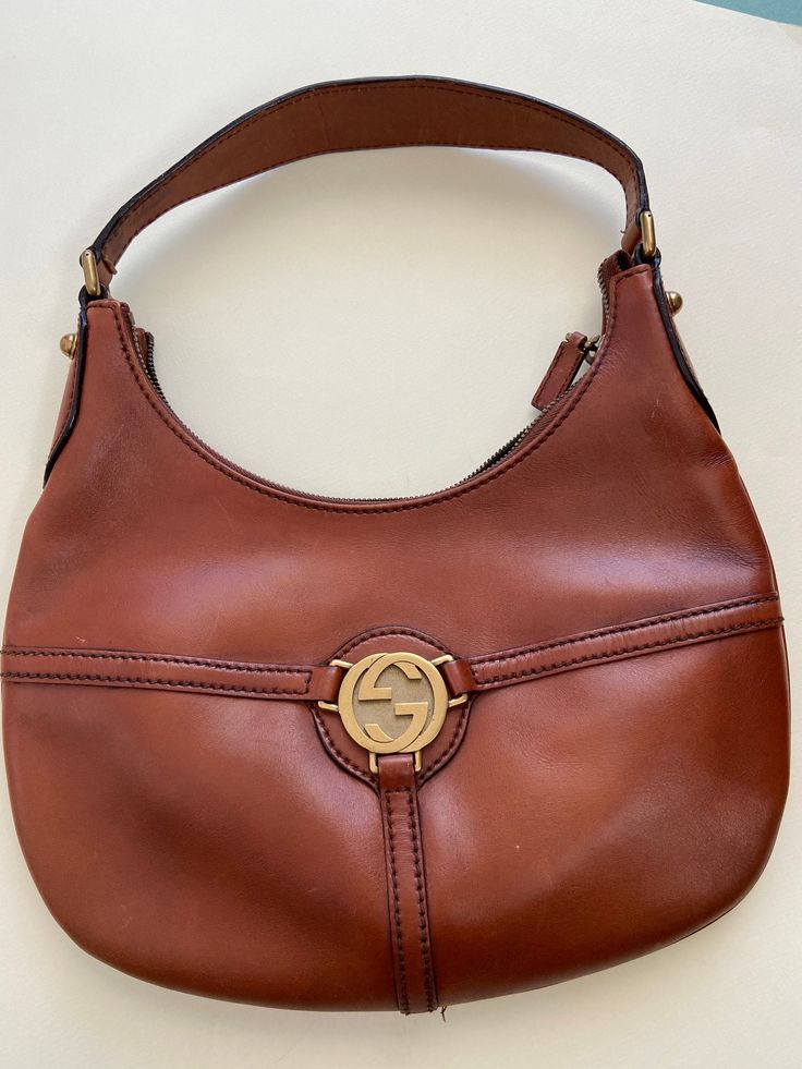 This beautiful Gucci Bag has a very good condition. It has some small signs on it, you can see on last photo, but still it is beautiful. Serial Number is   114869 213048 Condition is 9/ 10 Dimention:On photo About us This piece has been specifically selected by us, for you. We choose vintage and antique items which we think are beautiful, elegant and classic. We sell vintage items and we try to describe them accurately but i am not an expert. Please keep in mind that items are used and can show Vintage Hermes Crossbody Bag, Vintage Gucci Aesthetic, Leather Vintage Bag, Gucci Vintage, Bag Gucci, Vintage Leather Bag, Pretty Bags, Vintage Bag, Small Signs