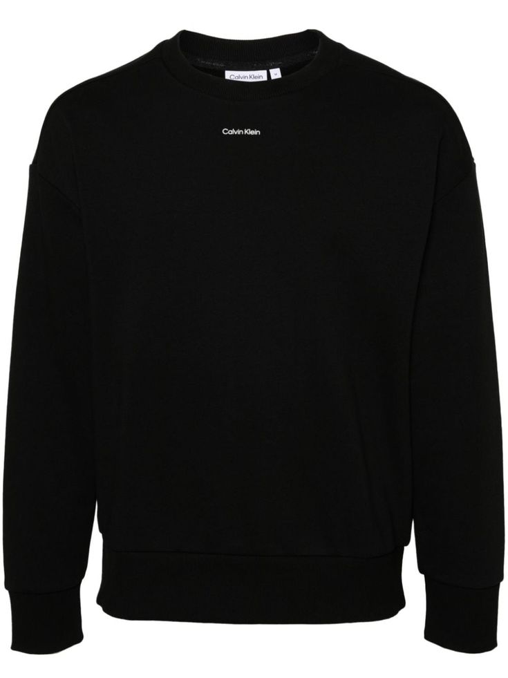 black cotton-modal blend jersey texture ribbed crew neck logo print to the front drop shoulder long sleeves ribbed cuffs and hem French terry lining Oversized Black Sweatshirt With Logo Detail, Casual Black Sweater With Logo Detail, Modern Crew Neck Sweatshirt With Logo Print, Modern Long Sleeve Sweatshirt With Logo Print, Basic Long Sleeve Sweatshirt With Logo Print, Modern Long Sleeve Sweatshirt With Logo, Classic Black Sweater With Logo Print, Classic Calvin Klein Crew Neck Top, Modern Black Sweatshirt With Ribbed Cuffs