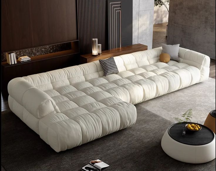 a large white couch sitting in a living room