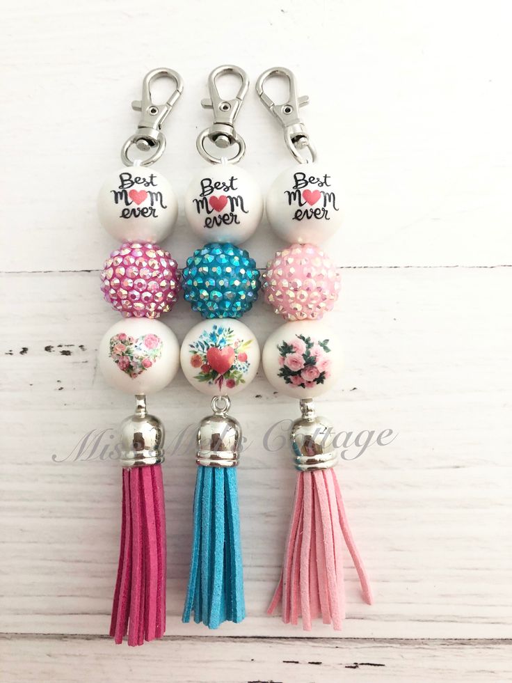 the keychain is decorated with beads and tassels that say best mom