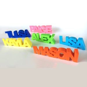 four colorful plastic letters that spell out the word usa, alex, kyna, and mason