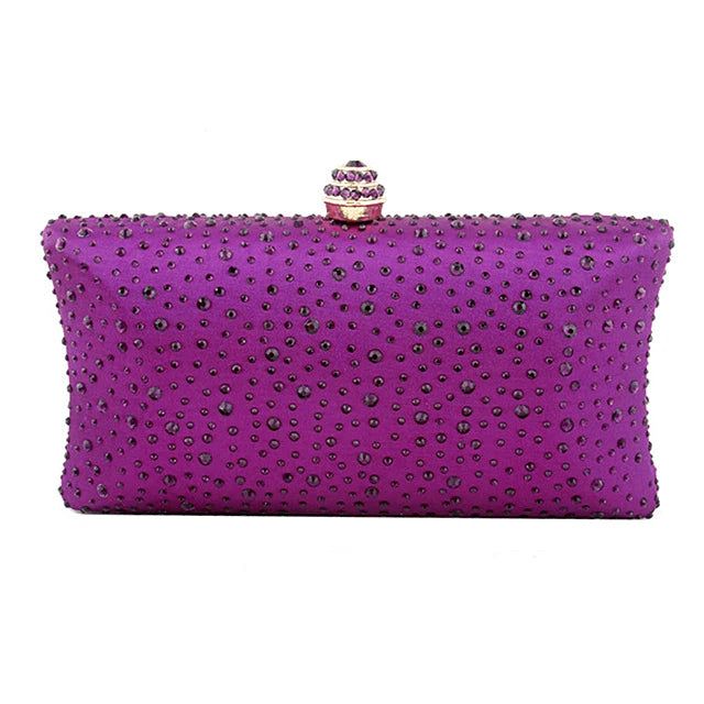 Crystals please, but in a sophisticated way! Embrace the exotic Boho Luxe and indulge in the vibrant elegance with our Glamour Crystal Clutch Bag – a burst of colour and style that exquisitely complements the Eclectic Boho Luxe vibe. Elevate your accessory game with this stylish statement clutch, featuring a crystal-studded clasp that adds a touch of designer flair to your ensemble. The playful yet sophisticated combination makes it the perfect statement piece to accentuate your individuality an Elegant Purple Party Bag, Elegant Purple Shoulder Bag For Party, Elegant Purple Handheld Bag, Glamorous Purple Party Bag, Elegant Purple Shoulder Bag, Chic Purple Shoulder Bag For Party, Purple Rectangular Party Bags, Rectangular Purple Party Bag, Luxury Purple Formal Bag