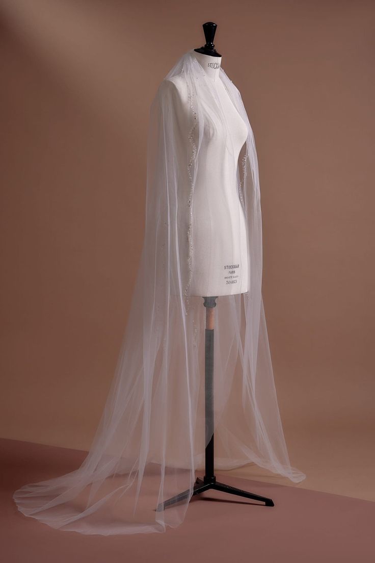 a mannequin with a veil on top of it