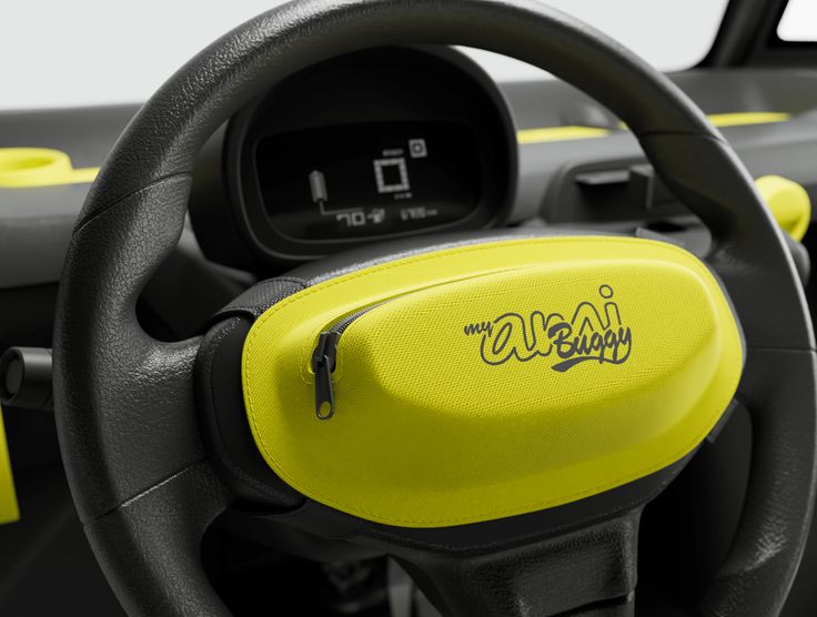 the steering wheel and dashboard of a car with yellow lettering on it's dash board