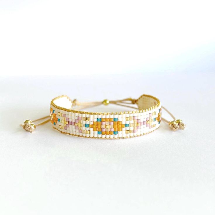 This bracelet is the perfect gift for every woman. Give a touch of color and simplicity to your daily outfit. ☆ ESPECIFICATIONS:  - Minimalist handmade bracelet made of 11-0 Japanese Miyuki glass beads and four 14K gold filled bead (never tarnish). - Miyuki beads are beaded in a special Miyuki thread and closed with a gold sliding bead. - Suitable for wrists of 5 inches (about 12.7 cm) and can be extend to 9 inches  (18cm). ☆ TAKING CARE YOUR BRACELET: - Handle with care, seed beads are delicate Tiny Beads Bangle Friendship Bracelets As Gift, Tiny Beads Friendship Bangle Bracelet As Gift, Bangle Friendship Bracelet With Tiny Beads, Multicolor Bohemian Braided Bracelets With Letter Beads, Bohemian Multicolor Braided Bracelet With Letter Beads, Bohemian Jubilee Beaded Bracelets As Gift, Colorful Beaded Bangle Friendship Bracelets As Gift, Colorful Beaded Bangle Friendship Bracelet Gift, White Beaded Bracelets For Crafting With Tiny Beads