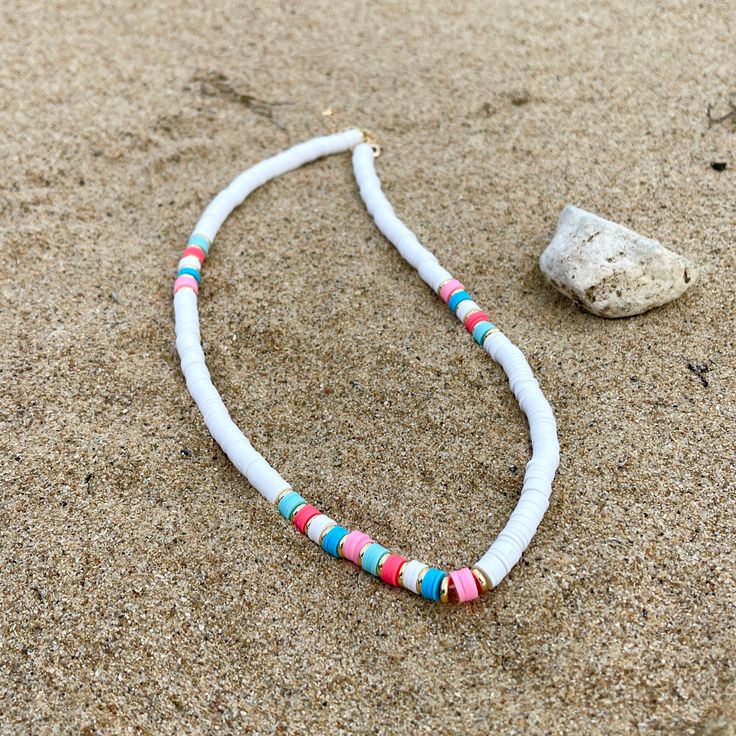 Fun white necklace with a touch of pastel beads details. - Size: 17.5" - 20" - Included: * 1 Necklace Beach Jewelry With White Letter Beads, White Letter Beads Jewelry For Beach, White Beach Jewelry With Letter Beads, White Tiny Beaded Necklaces For The Beach, White Round Bead Necklaces For The Beach, White Jewelry With Letter Beads For Vacation, White Jewelry With Round Beaded Chain, Trendy White Beach Jewelry, White Summer Jewelry With Tiny Beads