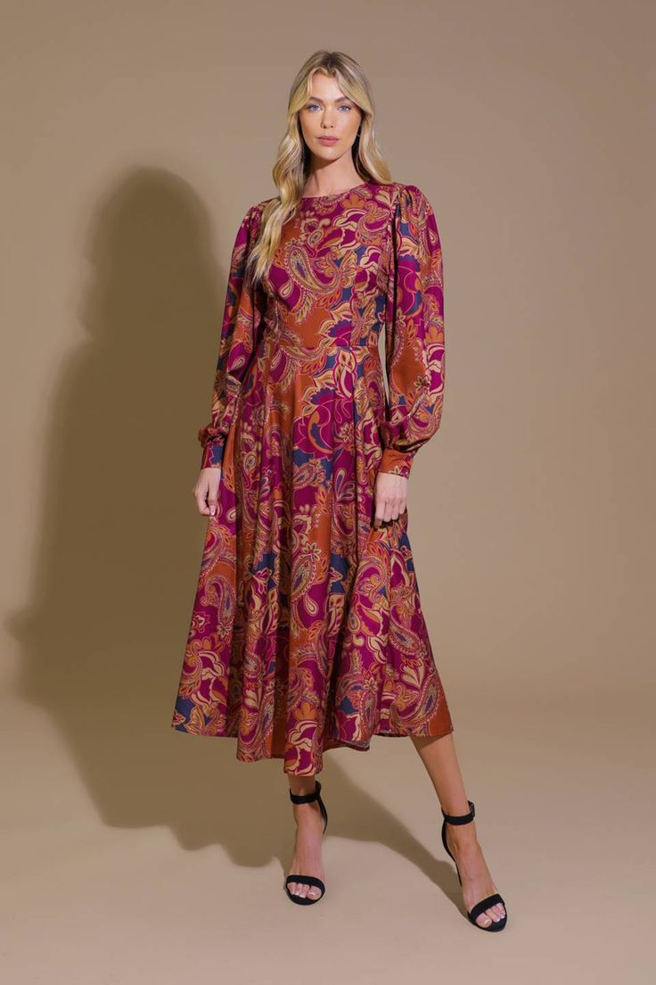 A printed woven midi dress featuring round neckline, long sleeve, A line skirt, back cut out with tie and zipper closure Details: Self : 100% PolyesterLining : 100% Polyesterr Size & Fit - Model is 5`8" And Wearing Size Small- Measurements Taken From Size Small- Approx. Length: 50" Floral Print Midi Long Sleeve Dress For Brunch, Patterned Long Sleeve Printed Midi Dress, Long Sleeve Midi Dress For Fall Brunch, Fall Midi Length Long Sleeve Dress For Brunch, Multicolor Midi Dress For Fall Brunch, Fall Multicolor Midi Dress For Brunch, Fall Floral Print A-line Long Sleeve Dress, Fall A-line Long Sleeve Dress With Floral Print, A-line Long Sleeve Floral Dress For Fall