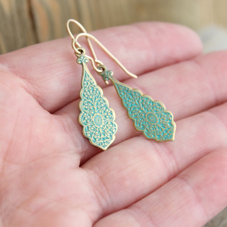 "These casual little earrings are perfect for every day. They are brass/gold with a greenish turquoise patina finish. The pair dangle from 14k gold filled ear wire that comes in two different styles... lever back or ball & hook. (pictured above) The earrings dangle at a total of 45mm (1 3/4\"). If you have any questions please do not hesitate to contact me. ALSO AVAILABLE IN SILVER... https://www.etsy.com/listing/214313768/dangling-silver-earrings-sterling-silver?ref=shop_home_active_15 GOLD Dainty Turquoise Hypoallergenic Jewelry, Dainty Hypoallergenic Turquoise Jewelry, Elegant Handmade Turquoise Teardrop Earrings, Hypoallergenic Turquoise Teardrop Jewelry, Nickel-free Teardrop Turquoise Jewelry, Elegant Turquoise Earrings With Lever Back, Elegant Turquoise Teardrop Earrings As Gift, Turquoise Teardrop Earrings For Jewelry Making, Turquoise Teardrop Jewelry For Pierced Ears