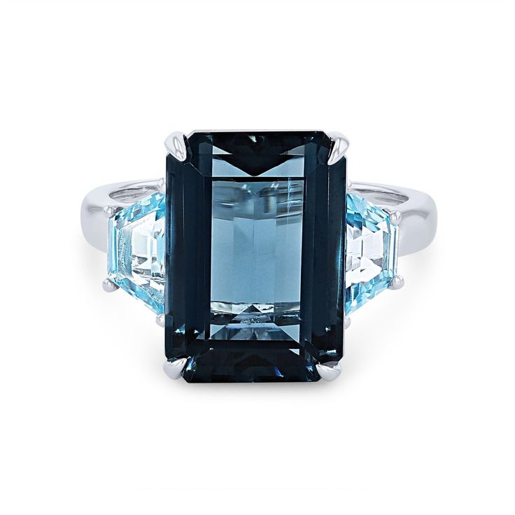 Blue Topaz Ring With Rectangular Stone, Blue Square Cut Topaz Ring, Blue Topaz Ring With Baguette Cut, Blue Baguette Cut Topaz Ring, Elegant Blue Baguette Cut Topaz Ring, Blue Radiant Cut Topaz Ring Fine Jewelry, Formal Blue Topaz Ring With Rectangular Stone, Blue Topaz Ring With Square Cut Gemstone, Emerald Green Ring