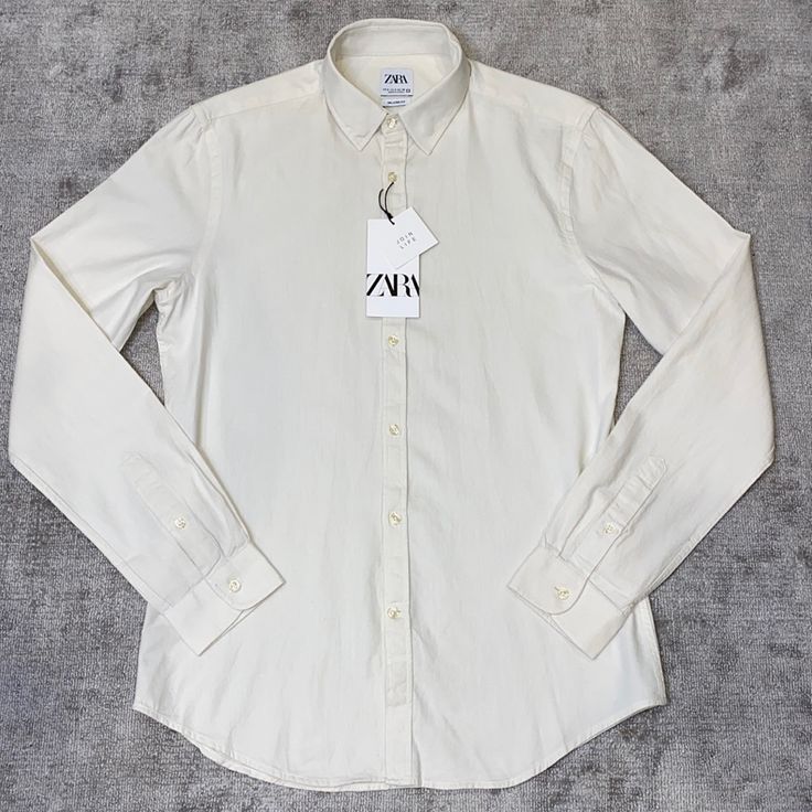 Off White Color White Cotton Slim Fit Shirt, White Slim Fit Cotton Shirt, White Slim Fit Spring Blouse, White Slim Fit Casual Shirt, White Collared Zara Shirt, Classic Cream Cotton Blouse, White Button-up Top From Zara, Fitted White Zara Shirt, Classic Off White Long Sleeve Tops