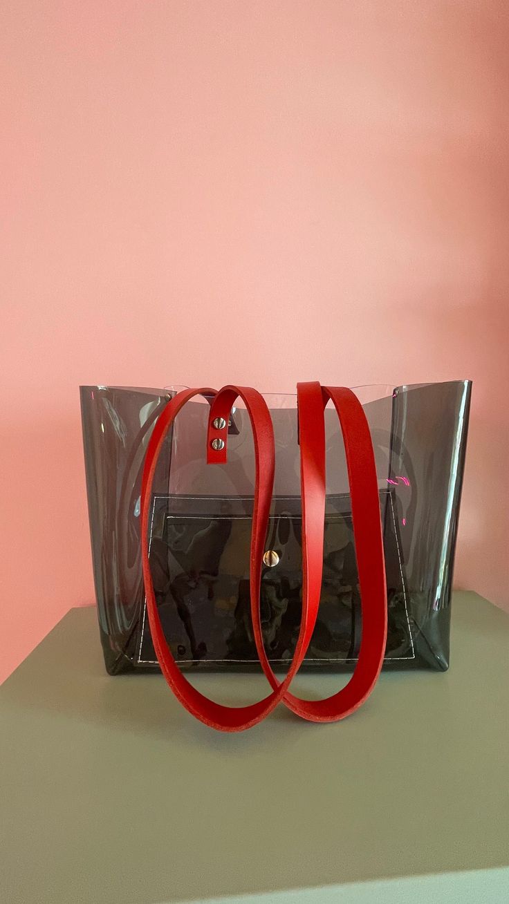 "City style, office bag, practical everyday tote, vinyl purse, shoulder handbag, oversize stylle, transparent tote, easy wipe, gift for nurse Dimensions: 12,5 inches  wide  10 inches height and 5 1/2 depth / 32 cm wide 25 cm height and 14 cm depth Made of thick, crystalline, flexible PVC. One side black and ane transparent clear. Leather straps colour  to choose ( in the picture caramel) A large handbag city, type of shopper .  The modern concept of boho style , oversize .  Large transparent  BA