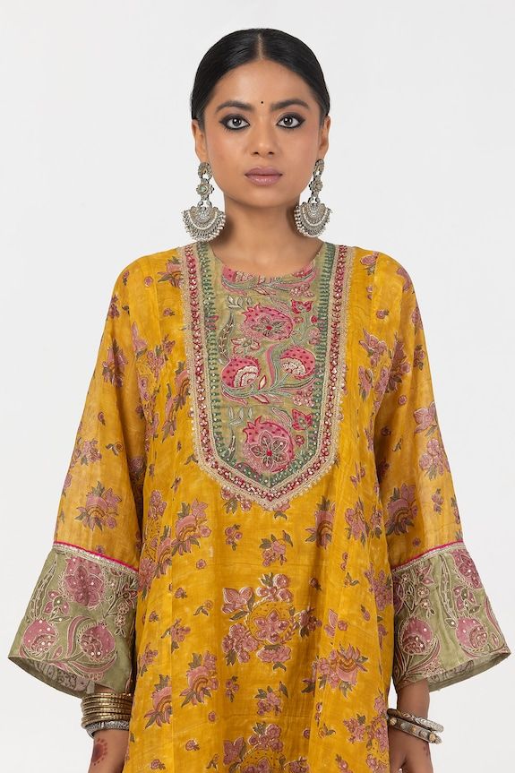 Mustard yellow short A-line kurta with floral block print and sequin embroidered yoke. Paired with matching embroidered hem salwar. - Aza Fashions Yellow Anarkali Set With Straight Kurta And Printed Motifs, Yellow Anarkali Set With Printed Motifs, Yellow Anarkali Palazzo Set With Printed Motifs, Yellow Chanderi Sharara With Printed Motifs, Traditional Yellow Palazzo Set With Printed Motifs, Yellow Palazzo Set With Printed Motifs In Traditional Drape, Yellow Palazzo Set With Printed Motifs And Traditional Drape, Anarkali Sets With Printed Motifs In Yellow, Yellow Salwar Kameez With Printed Motifs