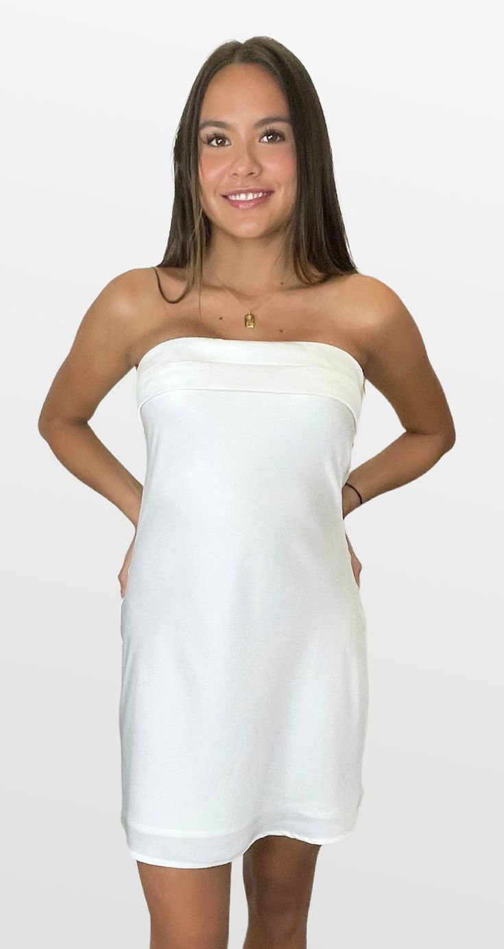 A perfect dress for that special occasion. This silky strapless dress has just the right detail to make you feel special. The fully lined dress has a double banded strapless neckline and a skirt that falls gently over the hips. The back has an elastic strap for fit and comfort, with a cowl detail that lightly exposes the back in a beautifully subtle way. Color- White (Also Available in Bright Pink and Sea Blue) 100% Polyester lining-95% Polyester 5% Spandex Strapless Satin Dress With Built-in Bra, Summer Strapless Mini Dress With Built-in Bra, Elegant Strapless Dress With Built-in Bra For Night Out, Elegant Summer Tube Top With Built-in Bra, Summer Strapless Dress With Straight Neckline And Lining, Spring Strapless Dress With Straight Neckline And Lining, Stretch Off Shoulder Dress With Straight Neckline, Elegant Strapless Lined Dress, Summer Satin Strapless Dress With Fitted Bodice