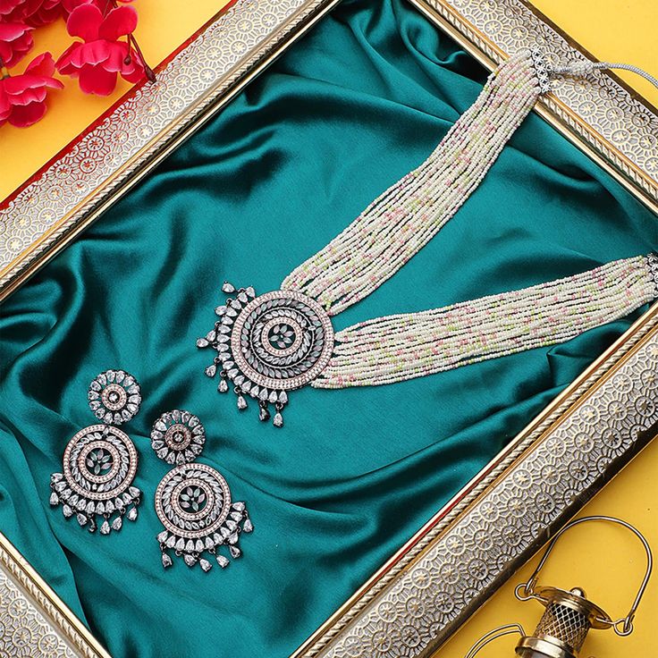 "Hey, Welcome to our shop! Indian Wedding Bridal Bollywood Jewelry American Diamond Stone Sabyasachi Inspired Indian Pakistani  High Quality Kundan Victorian AD Finish Long Necklace Set With Matching Earring For Women And Girl. Best Gift For Anniversary/ Birthday/ Engagement/ Christmas    < 1 DAY ITEM SHIPMENT | 7-8 Days Delivery TIME> About our Jewellery - Classic, Brilliant & Elegant. We deal in all type of Premium Indian Bollywood Jewellery. * AD Jewelry set * Kundan Necklace * Polki Jewellery * Uncut Jewellery * AD Ring * AD Bangles * AD Pendant Set * Pachi Kundan & many more.. * All our products are made with high-quality stones, the intricate texture and design makes it a must-have for every modern woman. 100% Brand New & 100% High Quality All jewelry Sets & Other Product Material : Festive Silver Beaded Temple Necklace, Elegant Party Necklace With Zari Work, Wedding Silver Beaded Temple Necklace, Bollywood Silver Pearl Necklace For Weddings, Bollywood Style Silver Pearl Wedding Necklace, Bollywood Style Silver Pearl Necklace For Wedding, Bollywood Style Silver Round Bridal Necklace, Bollywood Style Silver Bridal Necklace, Silver Beaded Chandbali Bridal Necklace