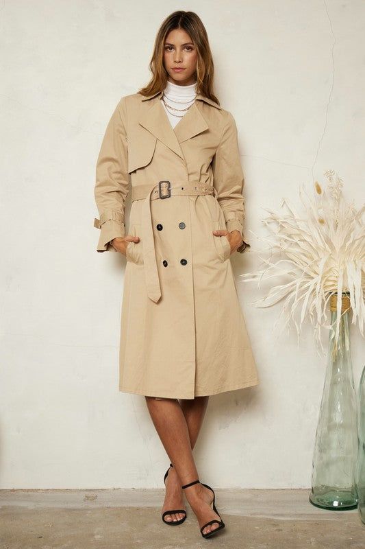 Description This Classic Trench Coat will never go out of style and instantly adds chic to any outfit. So many classic details make this an absolute must have addition to your capsule. It features double-breast styling, wide lapel, a collared neck and is self-belted. All About the Fit Fabric Feel (light) 1 2 3 4 (heavy) Fit (slimfit) 1 2 3 4 (loosefit) Fabric Details: 100% Cotton Chic Tailored Outerwear With Belted Cuffs, Elegant Collared Spring Outerwear, Chic Double-breasted Outerwear With Belted Cuffs, Chic Collared Belted Outerwear, Chic Belted Collared Outerwear, Spring Business Outerwear With Belted Cuffs, Chic Fitted Outerwear With Belted Cuffs, Fitted Double-breasted Collared Outerwear, Fitted Collared Double-breasted Outerwear