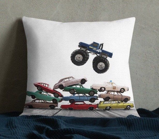 Monster Truck Jumping Pillow.  Original artwork by photographer Shawn St.Peter of Saint & Sailor Studios. This pillow is the perfect compliment to our wall art. This soft pillow is an excellent addition that gives character to any space. It comes with a soft polyester insert that will retain its shape after many uses, and the pillow case can be easily machine washed. Want to add a splash of color to your home? This premium feel pillow with a shape-retaining insert is just what you're looking for! It'll make any room luxurious and provide the perfect excuse for a quick power nap. * 100% pre-shrunk polyester case * Fabric with a linen feel * Hidden zipper * Machine-washable case * Shape-retaining 100% polyester insert included (handwash only) Monster Truck Quilt, Truck Quilt, Car Pillow, Power Nap, Soft Pillow, Sports Prints, Sports Art, Big Boy Room, Soft Pillows