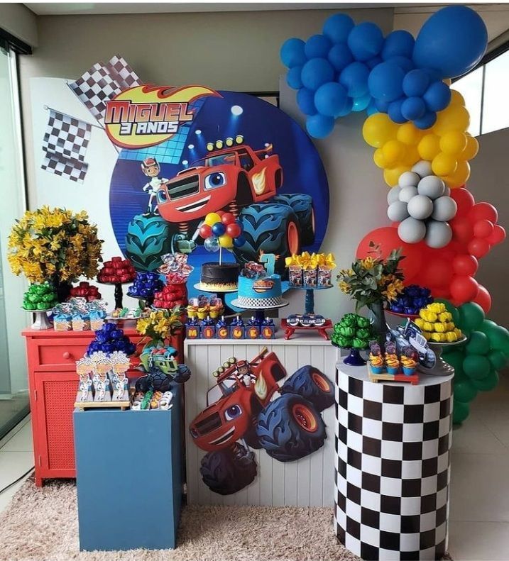 a birthday party with cars balloons and decorations