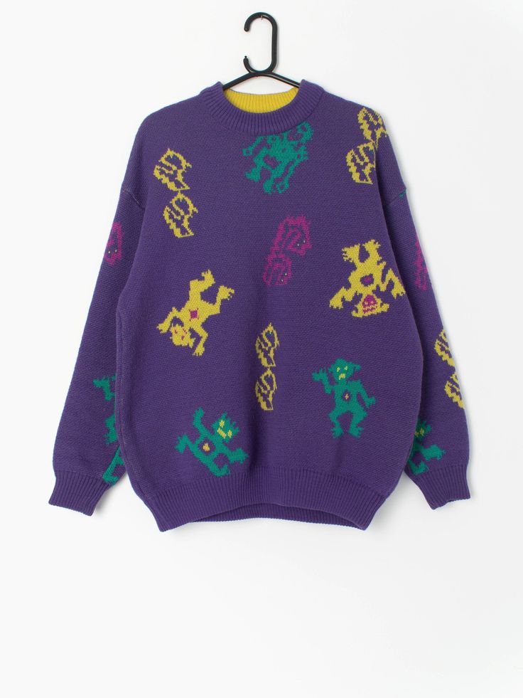 90s ski sweater in purple with funky monster figures by Le Jour Blanc. A bold purple ski sweater with a neon yellow, green and pink abstract monster pattern. This sweater features a super stretchy hem, a stretchy crew neck and cuffs. An awesome Le Jour Blanc label is stitched onto the back of the jumper. Made in France from a soft to touch heavy weight wool and acrylic blend.  Our recommended size: Large  Label says: Large Condition: Very good Material: 50% acrylic, 50% wool Measurements in inch Purple Graphic Print Sweater For Fall, Purple Graphic Print Crew Neck Sweater, Purple Crew Neck Sweater With Graphic Print, Retro Purple Sweater For Winter, Retro Purple Winter Sweater, Retro Purple Winter Tops, 90s Style Purple Sweater For Fall, 90s Style Purple Fall Sweater, Purple Crew Neck Sweater For Streetwear