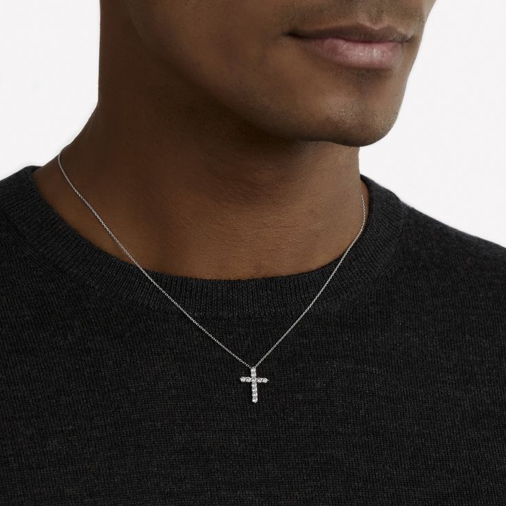 A precious interpretation of a classic motif, our mini cross pendant in white gold is available in a variety of different carat weights, seen here with 0.05 carat diamonds. Deftly suspended from a white gold chain, each diamond is embraced by a minimal metal setting, optimising their brilliance and presence. The Classic Graff collection celebrates the purity and fire of the finest Graff diamonds showcased in truly timeless jewels and eternally elegant silhouettes. An elegant Classic Graff cross Timeless Sterling Silver Cross Jewelry, Timeless Silver Cross Pendant Necklace, Sterling Silver Diamond Cut Silver Cross Necklace, Silver Sterling Silver Cross Necklace With Diamond Cut, White Gold Formal Cross Pendant Necklace, Classic White Gold Crucifix Necklace, Classic Diamond Pendant Cross Necklace, Luxury White Gold Cross Necklace With Diamond Accents, Sterling Silver White Gold Cross Pendant Necklace