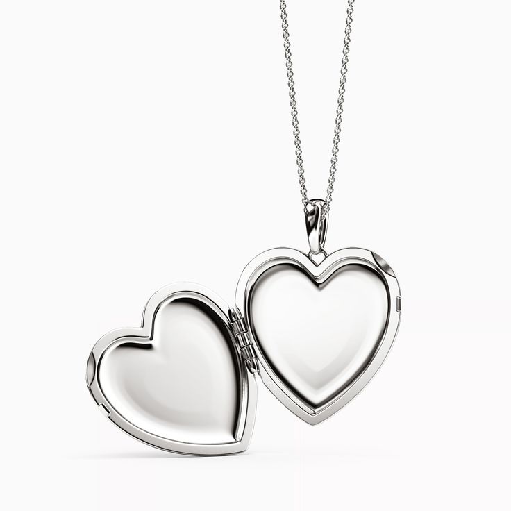 Hearts, precious metals, and diamonds that will never lose their shine serve as a symbol of our most humble and eternal gratitude. Silver Diamond Medallion Jewelry, Diamond Medallion Silver Jewelry, Keepsake Diamond Pendant Jewelry, Diamond Pendant Jewelry For Keepsake, Fine Jewelry Medallion As A Gift, Classic White Gold Oval Pendant Jewelry, Valentine's Day Fine Jewelry Locket, Elegant Heart Pendant Locket Necklace With Charms, Silver Diamond Keepsake Jewelry