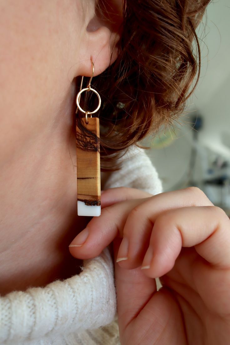 long wood rectangle earrings on ear with white sweater Wood And Stone Jewelry, Wood And Metal Jewelry, Wood Earring Designs, Resin Wood Earrings, Wood And Silver Jewelry, Wood Earrings Diy, Resin And Wood Earrings, Wood And Resin Jewelry, Wood Jewerly