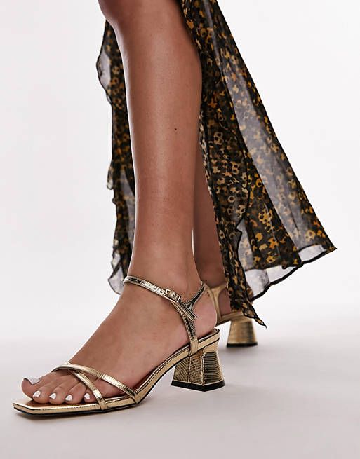 Topshop Iona strappy block heeled sandal in gold lizard | ASOS Chic Gold Ankle Strap Block Heels, Chic Gold Block Heels With Ankle Strap, Chic Gold Block Heels With Heel Strap, Chic Gold Block Heels With Stacked Heel, Gold Ankle Strap Block Heels For Spring, Gold Block Heels With Ankle Strap For Spring, Gold Block Heels With Heel Strap For Spring, Gold Ankle Strap Heels With Buckle Closure, Gold Ankle Strap Heels With Stacked Heel