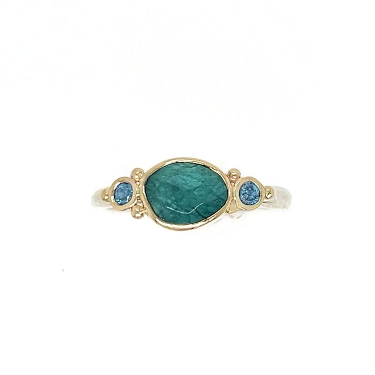 Originally discovered in Madagascar this unique stone is gaining in popularity due to its scarcity and its stunning coloring. Set in 14k yellow gold with a handmade sterling silver seagrass band we accented it with glowing blue zircons. Approximate stone size: 8mm x 6mm Approx TCW: 1.5cts Mohs hardness: 7.5 This one of a kind piece is handmade with love in Emily's Hudson Valley studio. If you have questions about sizing, shipping or need help deciding please reach out to us! Blue Zircon Ring, Colored Stone Engagement Rings, Stacked Engagement Ring, Coloring Set, Local Jewelry, Zircon Ring, Stone Engagement Rings, Diamond Shop, Blue Zircon