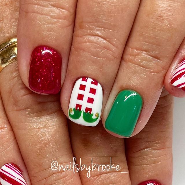 Brooke Jensen on Instagram: "These elf nails…are we kidding😍🎄👏🏼♥️ Believe it or not, this client has never seen the movie, Elf!!😱 But considering it’s in theaters for the 20th anniversary….might just be the year she finally sees it!!😏🎉 . . . . #gelpolish #handpaintednailart #naturalnailsonly #utahnailtech #utahnailartist #nailartist #nailart #naildesigns #nailartdesigns #freehandart #freehandnailart #gelnails #nails #nailmagazine #nailinspo #holidaynails #christmasnails #christmasnailart #decembernails #trendychristmasnails #festivechristmasnails #elfnails #elfnailart #elflegnails #peppermintnails #peppermintcandynails #candycanenails #candycanenailart #redglitternails #nailsbybrooke___Christmas" Elf Nail Designs, Christmas Elf Nail Art, Elf Inspired Nails, Buddy The Elf Nails, Elf Nails Designs, Elf Christmas Nails, Grinch Nail Ideas, Christmas Nails Kids, Elf Nail Art