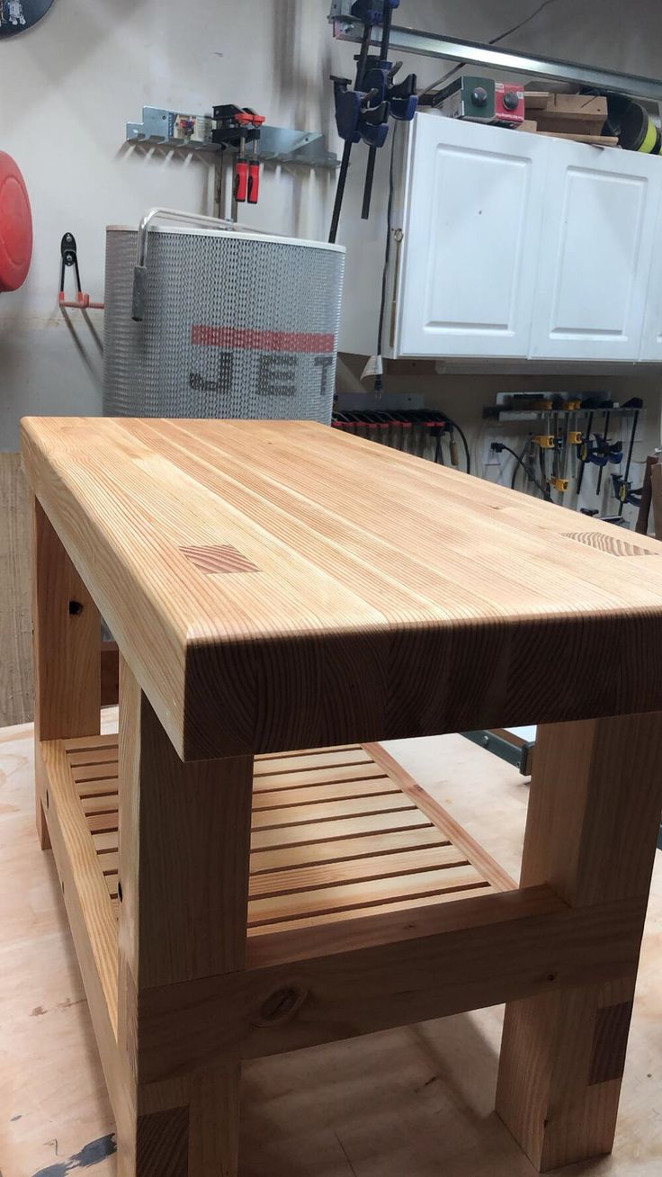 a workbench made out of wood in a garage