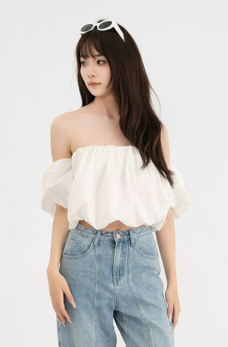 Embrace a touch of French-inspired fashion with our Ruffled Off-Shoulder Puff Sleeve Crop Top—an essential piece for your summer collection. Artfully crafted from 100% cotton, this top features a charming one-shoulder neckline and playful puff sleeves that add a whimsical twist to your ensemble. It's finished with a super short hemline, creating a silhouette that’s both flirtatious and on-trend. Pair it with high-waisted jeans or a sleek skirt for day events, or amp up the drama with statement a Trendy Summer Off-shoulder Top, Trendy Off-shoulder Top For Summer Day Out, Chic Spring Cotton Crop Top, Chic Cotton Crop Top For Spring, Spring Chic Cotton Crop Top, Chic Summer One Shoulder Crop Top, Trendy Summer Puff Sleeve Crop Top, Trendy Puff Sleeve Crop Top For Summer, Trendy Summer Crop Top With Puff Sleeves