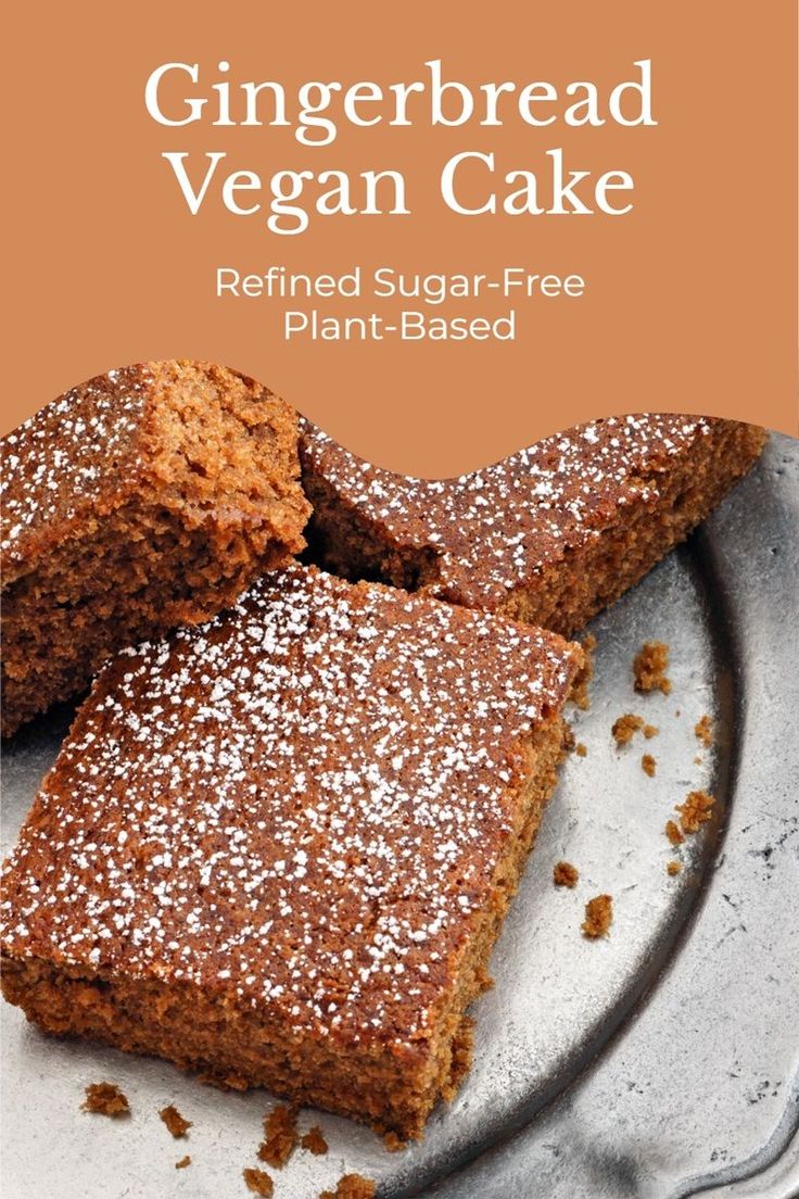 gingerbread vegan cake on a plate with powdered sugar - free plant - based