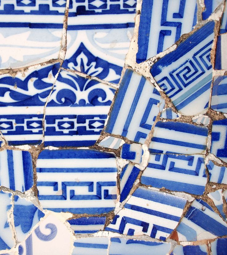 blue and white tiles with designs on them