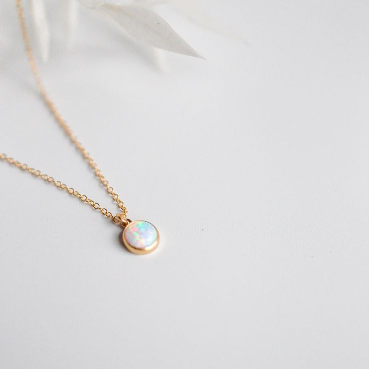 NEW OPAL! An absolutely stunning stone with vibrant colors like blue, pink, light purples.. I wanted to offer this as a set because it looks just incredible together. They're both such dainty pieces. They shines bright when it hits the light and is a statement piece while also being delicate and dainty. The opal is actually the October birthstone so this would make a great gift! The stone itself is 6mm / .25" 14k Gold Filled metal is a beautiful, affordable alternative to solid gold and can be w Round-shaped Jewelry Sets For Gifts, Gift Jewelry Sets With Jewels, Delicate Gemstone Round Pendant Jewelry, Delicate Round Pendant Gemstone Jewelry, Everyday Opal Jewelry With Gemstones, Everyday Opal Gemstone Jewelry, Adjustable Round Opal Jewelry, Round Pendant Jewelry As A Gift, Dainty Rose Gold Jewelry With Round Stone