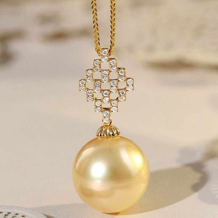 * Condition: Brand new * Center Stone: Natural Golden South Sea Pearl 13-14mm * Side Stone: Natural White Diamond, Round Cut, approx 0.15ct (VVS clarity with F color)  * Pearl Shape Grade: Perfectly Round * Metal Purity: 18K Solid Yellow Gold * Necklace Chain Length: 40-45cm (adjustable) * Superior pearls standard - 99% of the pearl surface is clean. An extremely detailed and up-close study of the pearl is needed to find imperfections. * The item will be gift wrapped and shipped. --------------- Luxury Yellow Gold Refined Pearl Necklace, Timeless Gold Pearl Necklace With Diamonds, Gold Diamond Pearl Necklace Fine Jewelry, Luxury Pearl Necklace With Diamond Accents, Gold Pearl Necklace With Diamond Accents, Elegant Yellow Gold Pearl Necklace For Formal Occasions, Gold Necklace With Brilliant Cut, Exquisite Yellow Gold Round Pearl Necklace, Exquisite Yellow Gold Pendant Pearl Necklace