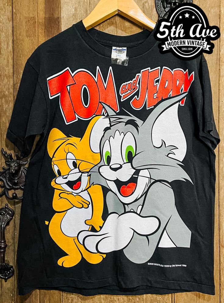 #TomandJerry #cartoon #cartoontee #tee #tshirt #streetwear #vintagereprint #y2k #shopvintage #thrift #thriftshop #90sstyle #vintageclothing #vintaget #bootleg Tom And Jerry T Shirt, Tom Og Jerry, Vintage Animation, Tom Y, Vintage Band Shirts, William Hanna, Vintage Band T Shirts, Tshirt Streetwear, Tom Y Jerry