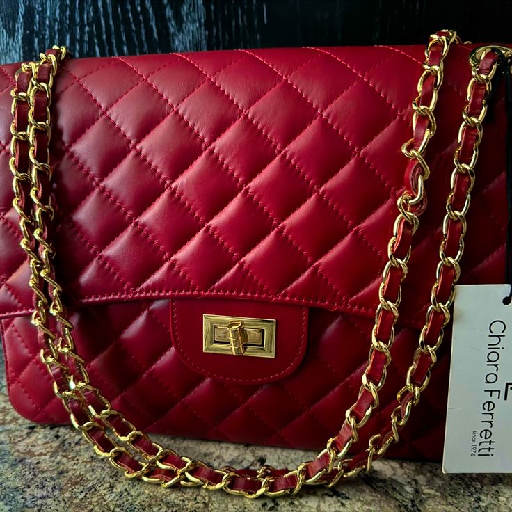 This Is A Chiara Ferretti Red Quilted Florence Bag Made In Italy. It Is A Crossbody/Shoulder Bag. Luxury Red Rectangular Shoulder Bag, Designer Red Flap Bag For Shopping, Luxury Red Shoulder Bag With Removable Pouch, Luxury Red Flap Bag With Removable Pouch, Classic Red Flap Bag For Shopping, Luxury Red Shoulder Bag With Detachable Handle, Luxury Red Crossbody Bag, Red Flap Bag With Detachable Handle For Travel, Luxury Red Flap Bag