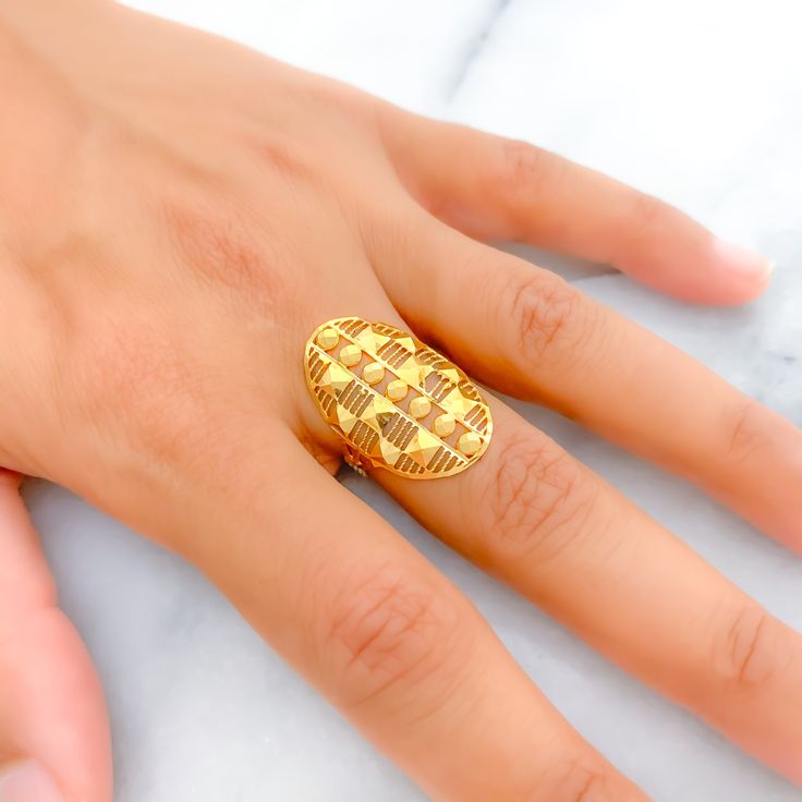 This Striped Cutwork oval ring, beautifully crafted from 22k gold and weighing 2.3 grams, showcases a luminous yellow gold finish. Sized at 6.5, it features intricate engravings that add depth and character to the classic design. With ring sizing available, it ensures a personalized fit for any wearer. Ideal for those who appreciate the elegance of traditional craftsmanship combined with the timeless value of gold, this ring offers a unique blend of artistry and sophistication, making it a distinguished addition to any jewelry collection. Product Details Gold Purity(karat): 22k Gold Weight(grams): 2.3 Item Finish: Yellow Gold Ring Size: ﻿6.5﻿ Ring Sizing Available: Yes // Gold Oval Engraved Ring With Polished Finish, Gold Oval Ring With Polished Finish, Oval Engraved Ring With Polished Finish In Gold, Oval Gold Plated Rings Hallmarked, Oval Gold-plated Rings Hallmarked, Oval Gold Plated Rings, Gold Oval Engraved Luxury Ring, Luxury Gold Oval Engraved Ring, Luxury Gold Engraved Oval Ring