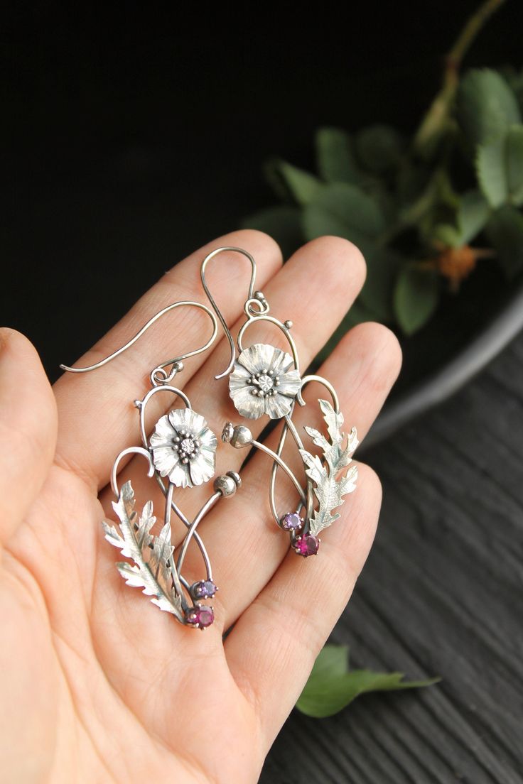 ITEM DESCRIPTION: Size H 65 x W 25 mm (2 1/2 x 2/3 inches) with closure. Weight - 4 g of each other. I made these botanical earrings of sterling silver, rhodolite and amethyst. This is very delicate and detailed work. These summer flowers look really elegant and amazing in silver. You can order these earrings with different gems. If you do not see your favorite version there, please write to me in convo and we will discuss your order. Jewelry will come to you in a gift box - ready for gifting. M White Metal Flower Shaped Jewelry, White Metal Flower-shaped Jewelry, Silver Flower Jewelry With Matching Earrings, Delicate Silver Flower Earrings Nickel-free, Delicate Silver Flower Earrings Nickel Free, Silver Pierced Flower Earrings For Gift, Delicate Silver Nickel-free Flower Earrings, Delicate Silver Drop Flower Earrings, Silver Delicate Nickel-free Flower Earrings