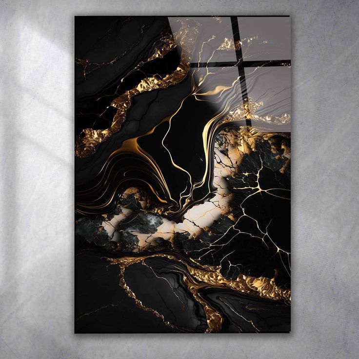 a black and gold abstract painting on a wall