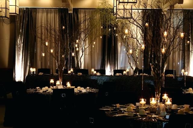 the tables are set with candles and place settings for an elegant dinner or party in black linens