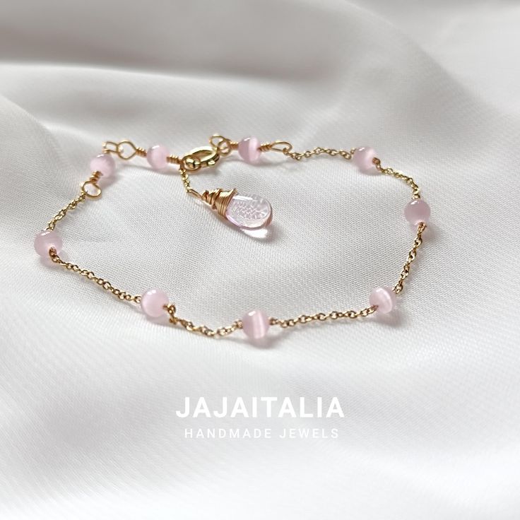 Discover this elegant minimalist gold beaded bracelet, enriched with pink cat's eye (chrysoberyl) beads and a refined handcrafted extension ending with a rose quartz crystal drop. This bracelet makes a perfect gift for her, handcrafted and custom made to fit any wrist. Product Details: Materials: Pink cat's eye (chrysoberyl) beads, gold plated chain, gold plated 925 silver clasp, rose quartz crystal drop. Measures: The bracelet covers sizes from 16.5 cm up to 21 cm thanks to the handcrafted exte Delicate Adjustable Rose Quartz Beaded Bracelets, Delicate Rose Quartz Bead Jewelry, Diy Hair Vine, Adjustable Minimalist Rose Quartz Bracelets, Minimalist Pink Rose Quartz Bracelet, Pink Quartz Bracelet, Blouse Designs High Neck, Gold Bead Bracelet, Jewellery Diy