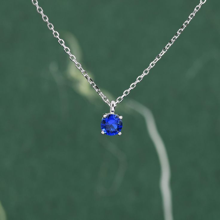 Sapphire Blue CZ Pendant Necklace  in Sterling Silver,  0.5 carat Sapphire Blue Zircon Necklace, Blue Necklace Dimensions : 40+5cm extension chain.  Stone size is available in  5mm (0.5ct) or 6.5mm (1ct）- for size comparison, please see the last picture.  Metal Stamp: 925 SRS ( SRS is our brand initials for Silver Rain Silver) Materials and Care: These are made of sterling silver and coated with precious metal Rhodium. They are hypoallergenic. They are tarnish resistant but please keep in a seal Blue Sapphire Birthstone Necklace Gift, Blue Sapphire Birthstone Necklace For Gift, Sapphire Birthstone Pendant Necklace, Sapphire Tanzanite Birthstone Necklaces, Blue Pendant Birthstone Necklace For Anniversary, Sapphire Birthstone Necklace In Lab-created Sapphire, Sapphire Birthstone Necklace With Lab-created Sapphire, Blue Diamond Cut Necklace In Sterling Silver, Lab-created Sapphire Birthstone Necklace