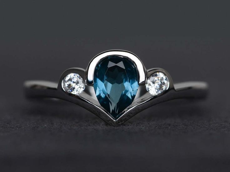 Welcome to my shop, you can find many beautiful gemstone jewelry here, and you also can ask for customized service. Main Stone: London blue topaz, pear cut, measures 5*7mm, weight about 0.95 carats. Accent Stones: cz Metal: 925 sterling silver plated with rhodium. I also can provide metal options such as 14k solid yellow/white/rose gold Setting: bezel setting more rings: https://www.etsy.com/shop/XCjewelryStudio?ref=hdr_shop_menu It's a perfect gift for the person who was born in November (Birth Blue Topaz Teardrop Promise Ring, Sterling Silver Teardrop Topaz Ring, Elegant Teardrop Topaz Ring In Sterling Silver, Teardrop Topaz Promise Ring, Ring Teardrop, Blue Gemstone Ring, Pear Cut Ring, Ring Three Stone, Blue Gemstone Rings