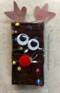 a piece of chocolate that has been decorated to look like a reindeer's face