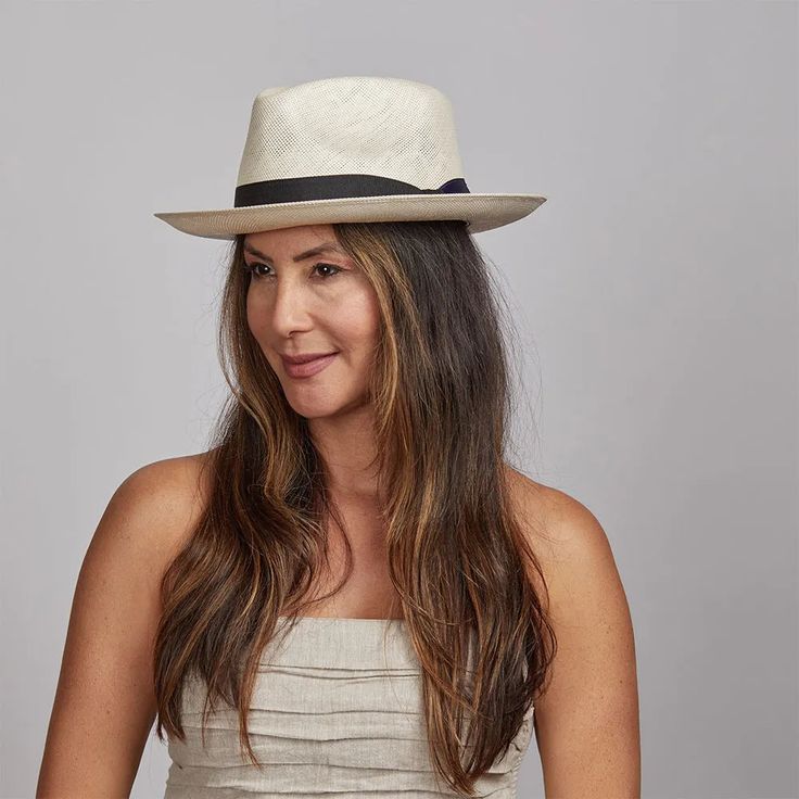 Our refined womens fedora hat adds a touch of sophistication to any outfit with its structured shape, pinched crown, and downturned brim. Whether worn for a casual stroll or a formal event, this timeless piece exudes an air of exclusivity and elegance. Womens Fedora Hat, Womens Fedora, Straw Fedora Hat, Straw Fedora, Fedora Hat, Timeless Pieces, Formal Event, Ibiza, Fedora